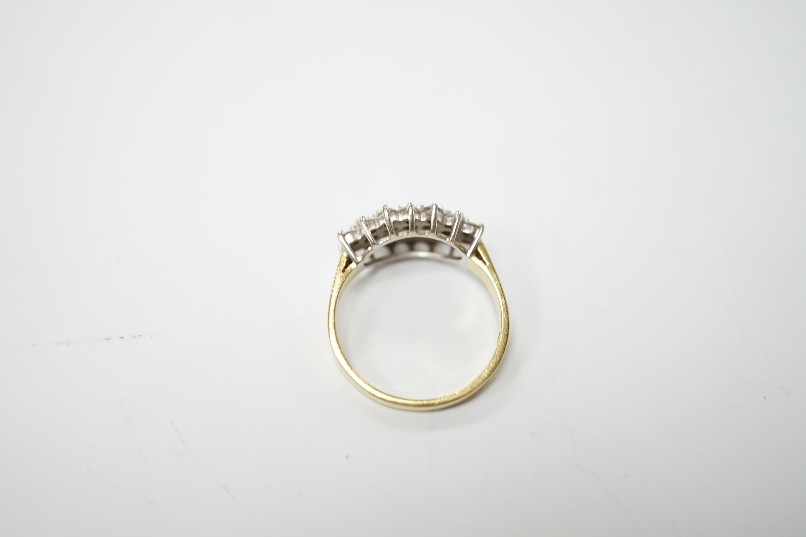 A modern 18ct gold and diamond cluster set dress ring, size P, gross weight 4.4 grams.